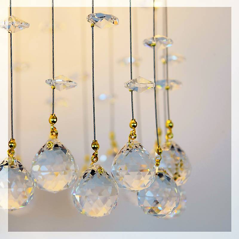Wandleuchter Tialda Erleuchtung, Gold/Transparent, aus Glas
